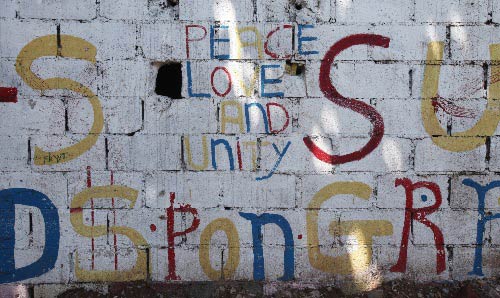 Grafitti saying 'Peace Love Unity'.