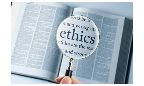 A magnifying glass held over an open book, focusing on the word 'ethics'.