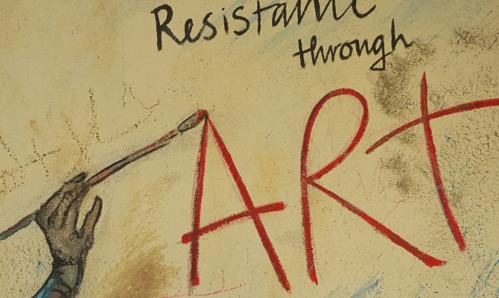 A drawing of 'Resistance through art' painted on a wall